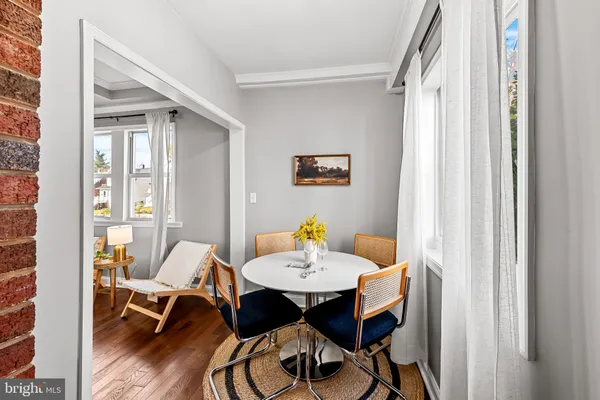 a view of a dining room with tables and chairs