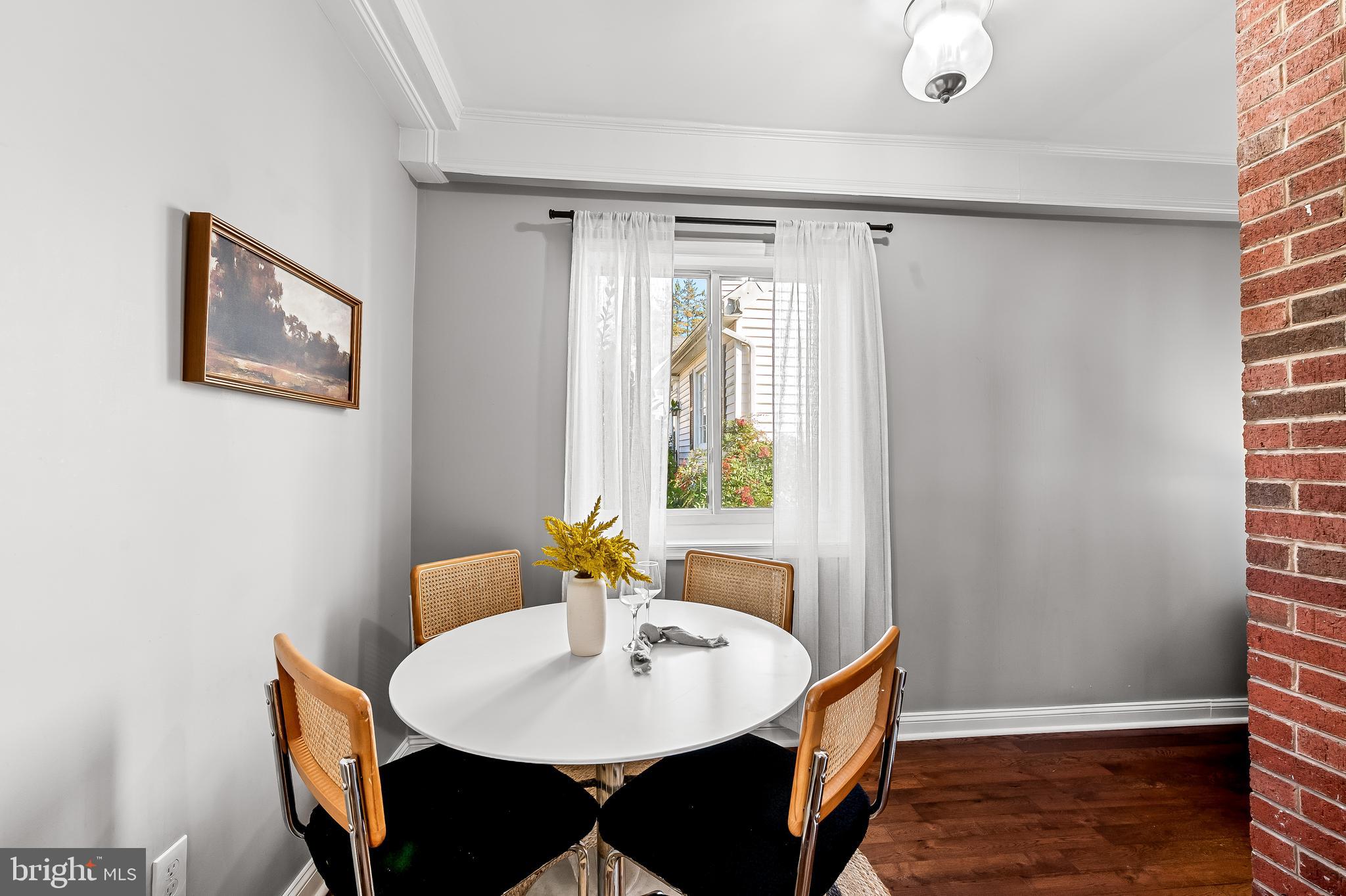 709 Cedarcroft Road Baltimore, MD 21212 - Photo 9 of 38 a view of a dining room with furniture and wooden floor