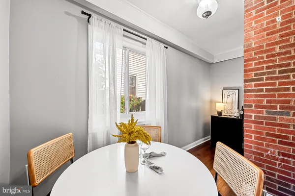 a close view of a dining table and chairs