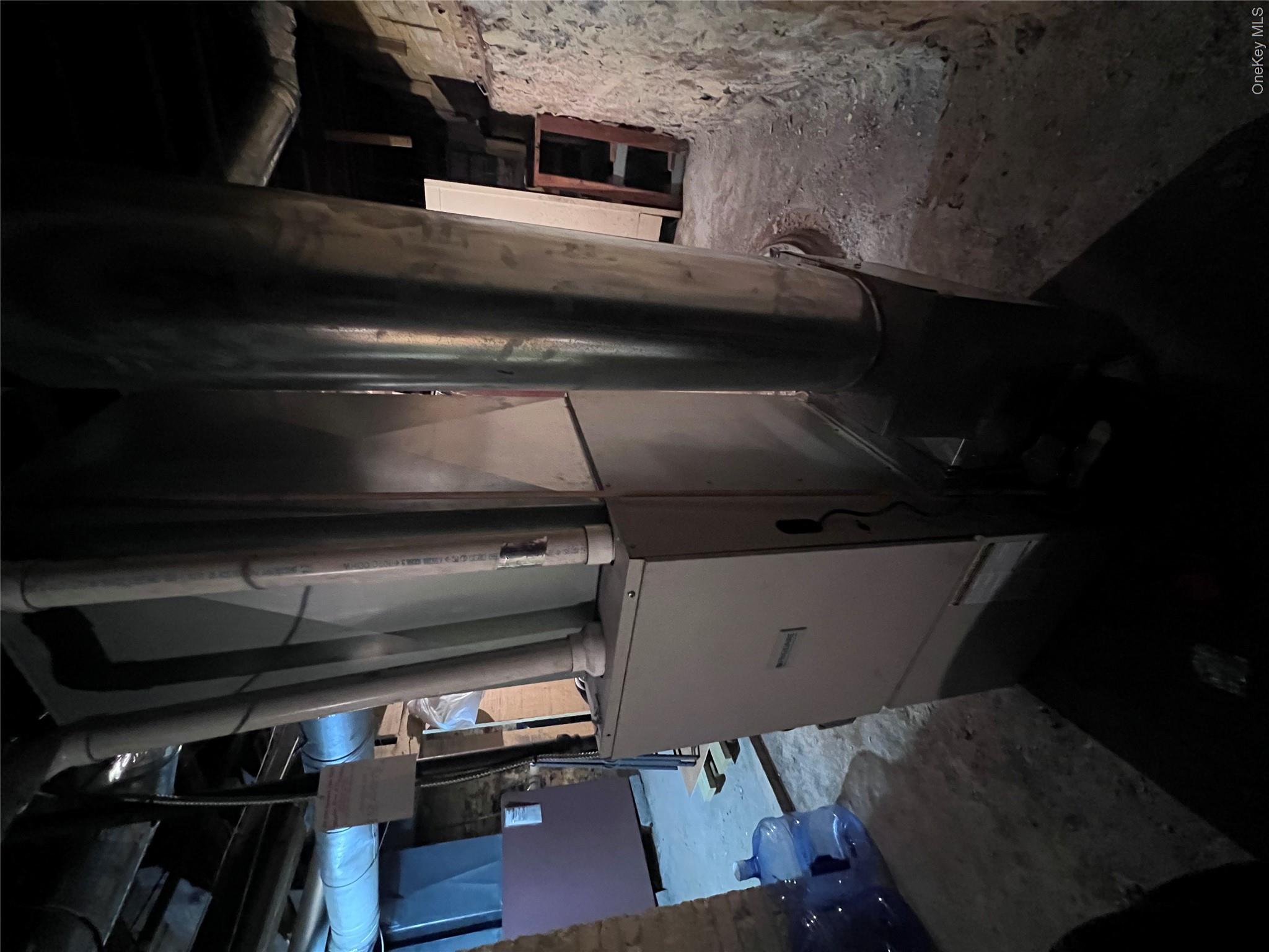 12 May Street Poughkeepsie, NY 12603 - Photo 15 of 17 a bed room with furniture and a refrigerator