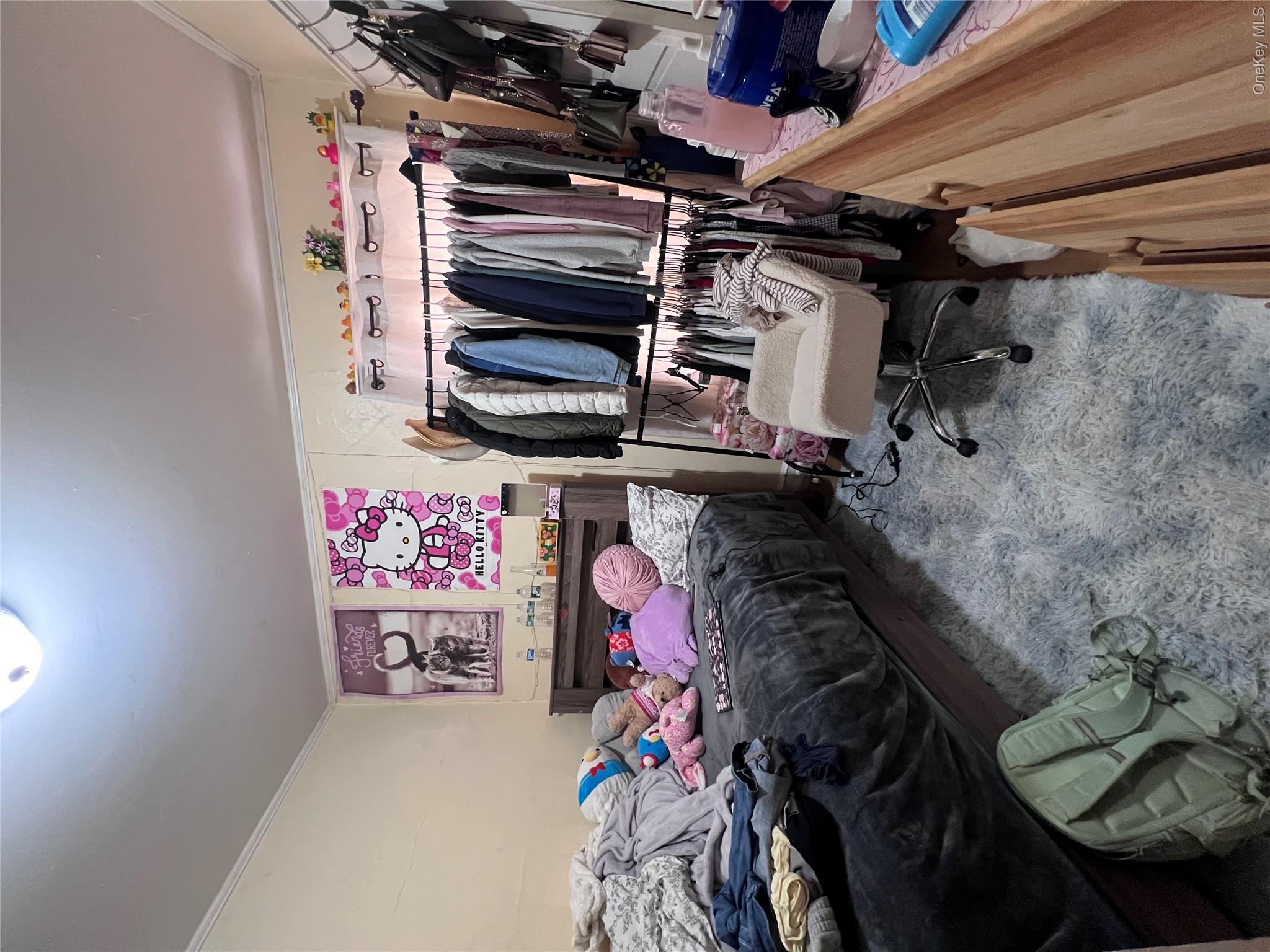12 May Street Poughkeepsie, NY 12603 - Photo 4 of 17 a bedroom with a bed and a desk