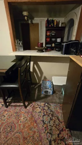 a room with chairs and wooden floor