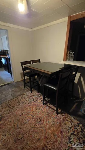 a kitchen with stove and cabinets