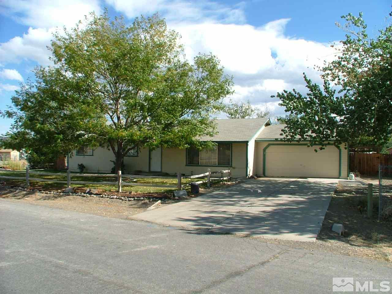 100 Ring Road Dayton, NV 89403 - Photo 1 of 1 a view of a house with a yard and large trees