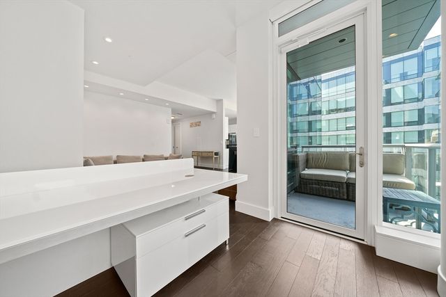 a en suite bathroom with a double vanity sink and a mirror