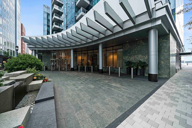 an outdoor space with patio furniture and potted plants