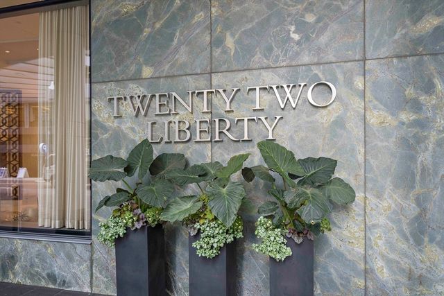 a vase with white and yellow flowers