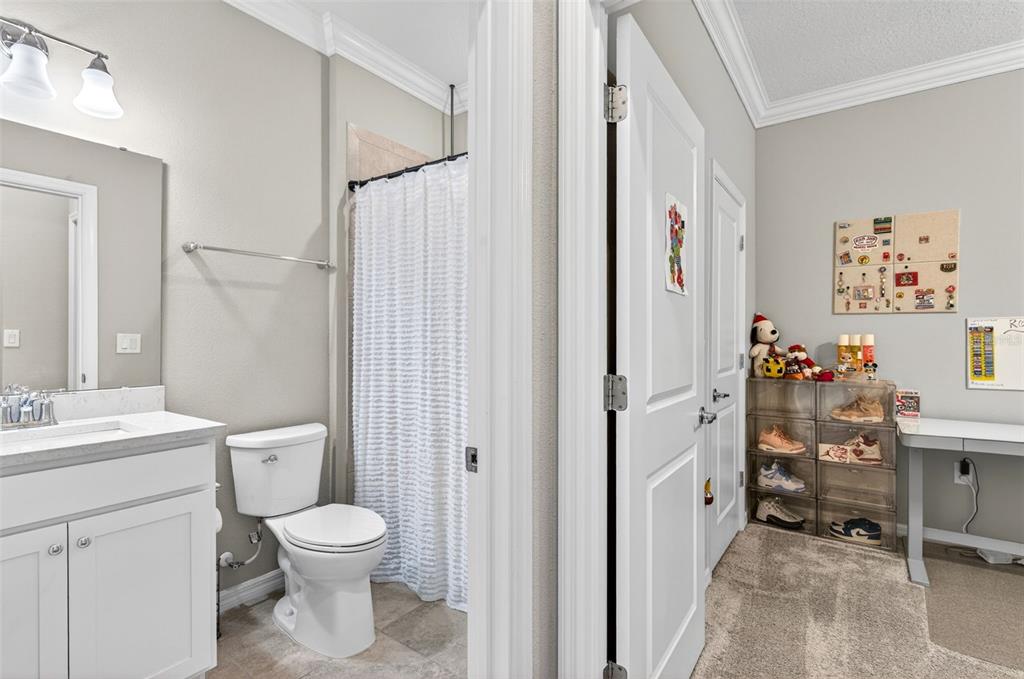 6427 Mooring Line Circle Apollo Beach, FL 33572 - Photo 20 of 34 a bathroom with a toilet sink and shower