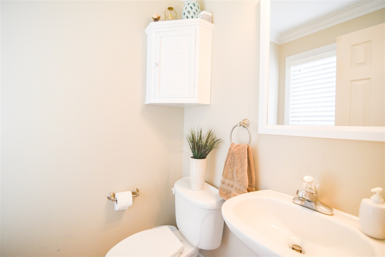 9200 Dawnshire Road Raleigh, NC 27615 - Photo 17 of 30 Convenient first floor powder room features a pedestal sink. Bathroom