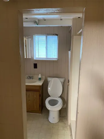 a bathroom with a sink a toilet and bathtub