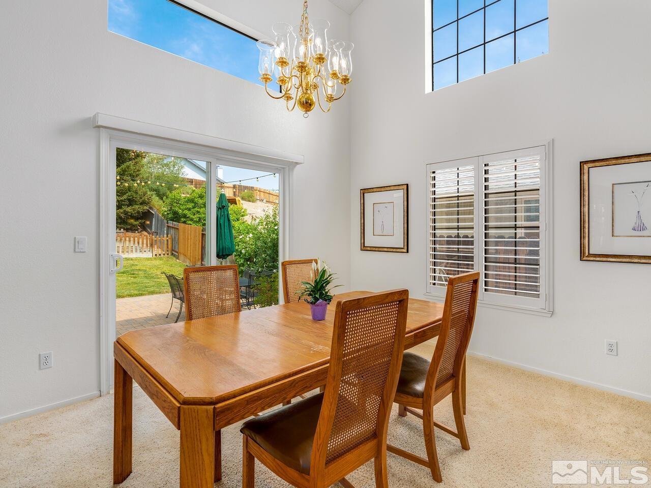 1722 Rainbow Ridge Road Reno, NV 89523 - Photo 12 of 27 a view of a dining room with furniture window and outside view