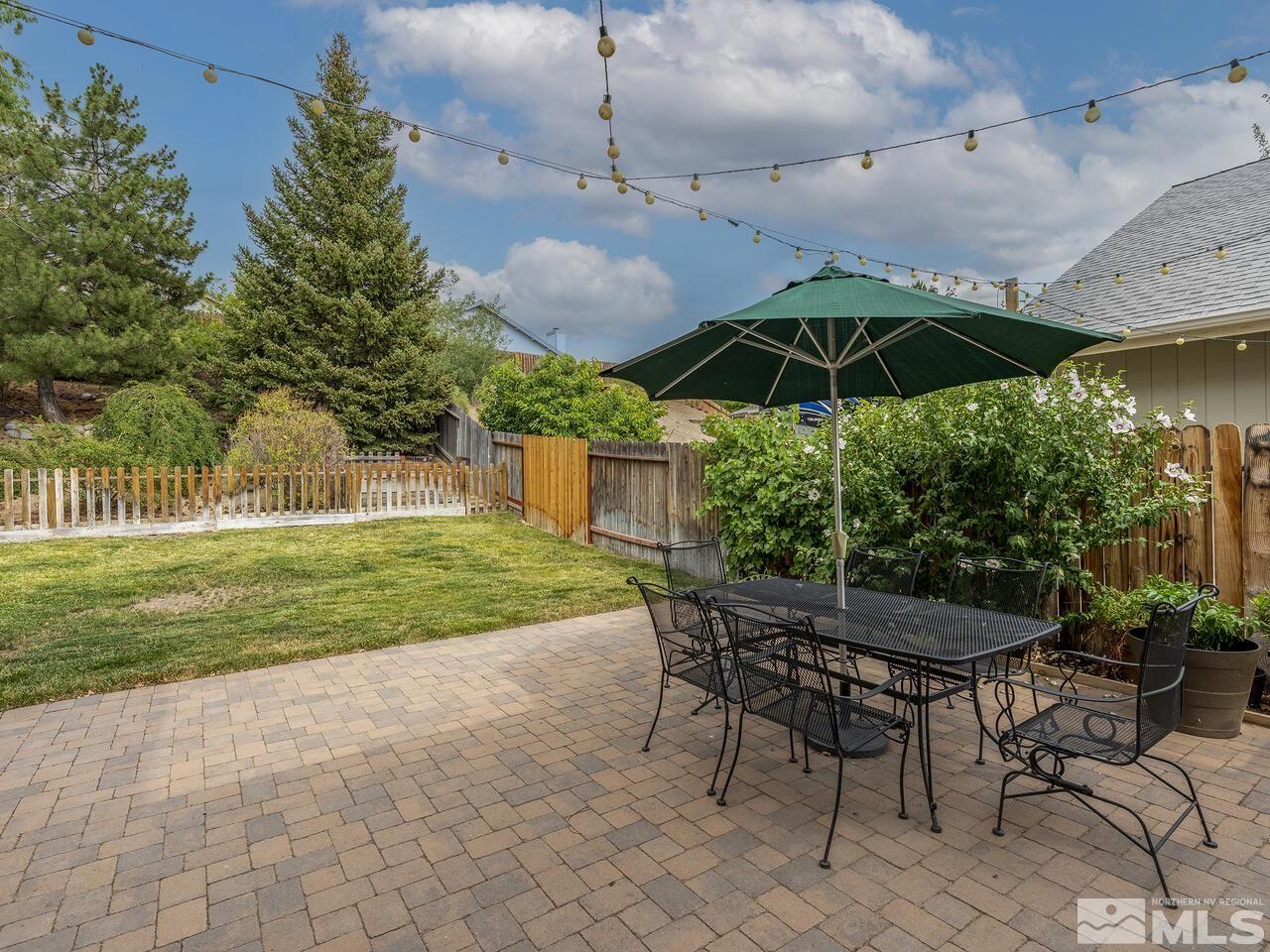 1722 Rainbow Ridge Road Reno, NV 89523 - Photo 16 of 27 a view of a table and chairs under an umbrella
