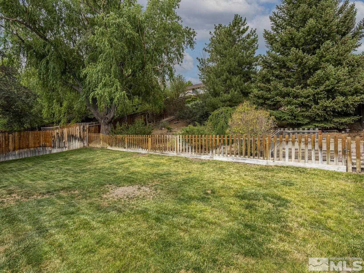 1722 Rainbow Ridge Road Reno, NV 89523 - Photo 17 of 27 a view of a yard with wooden fence