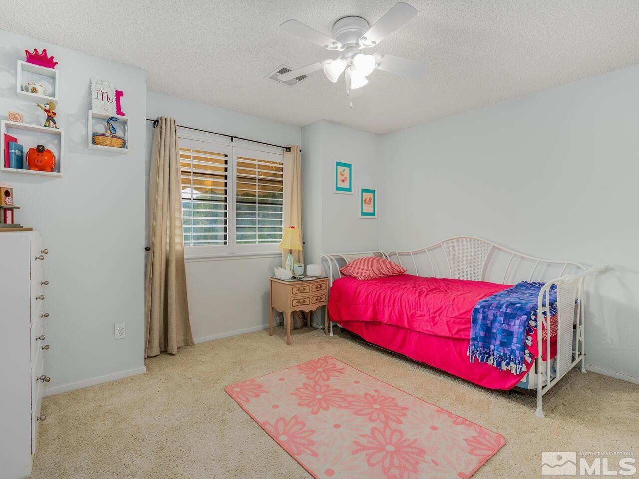 1722 Rainbow Ridge Road Reno, NV 89523 - Photo 23 of 27 a bedroom with furniture and a window