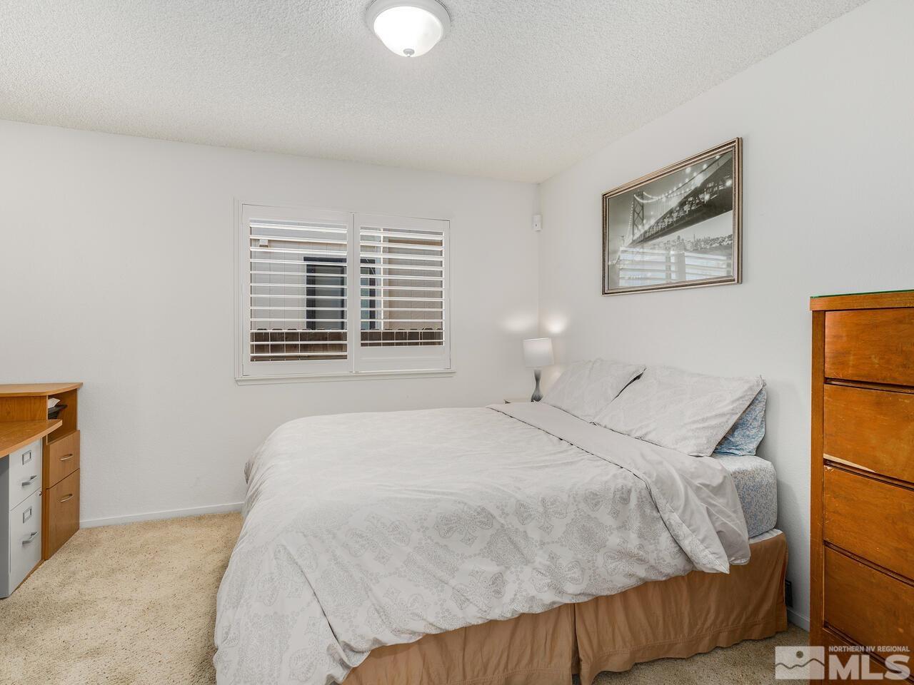 1722 Rainbow Ridge Road Reno, NV 89523 - Photo 24 of 27 a bedroom with a bed and a window