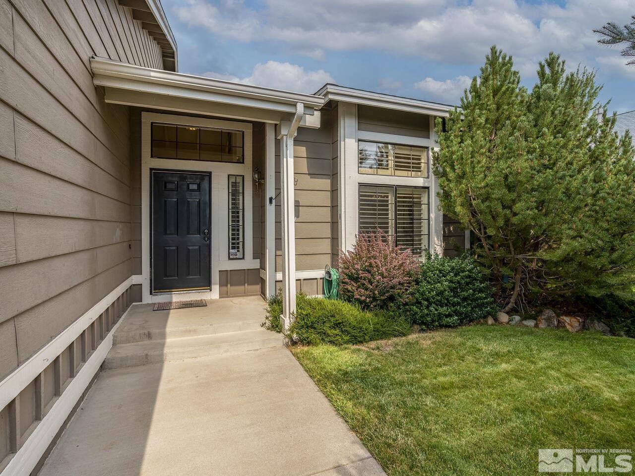1722 Rainbow Ridge Road Reno, NV 89523 - Photo 27 of 27 a front view of a house with garden
