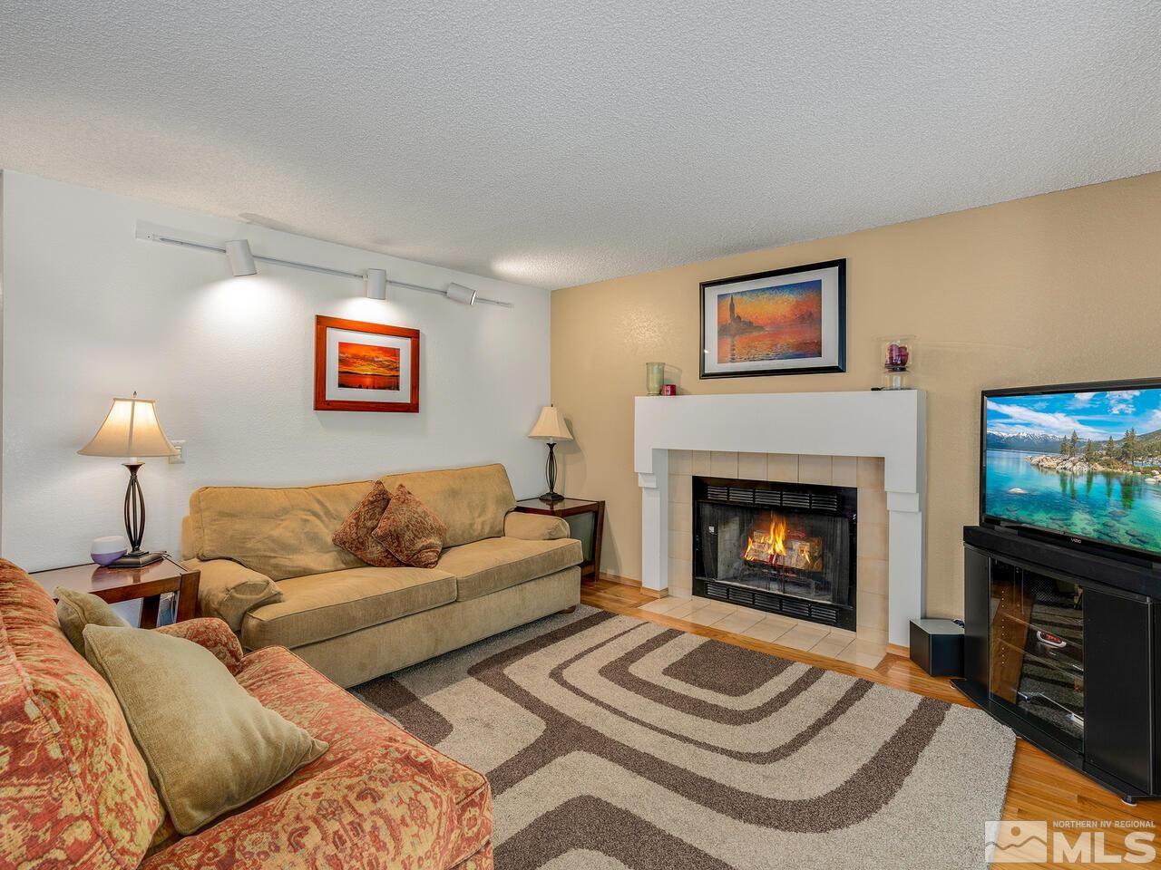 1722 Rainbow Ridge Road Reno, NV 89523 - Photo 6 of 27 a living room with furniture and a fireplace