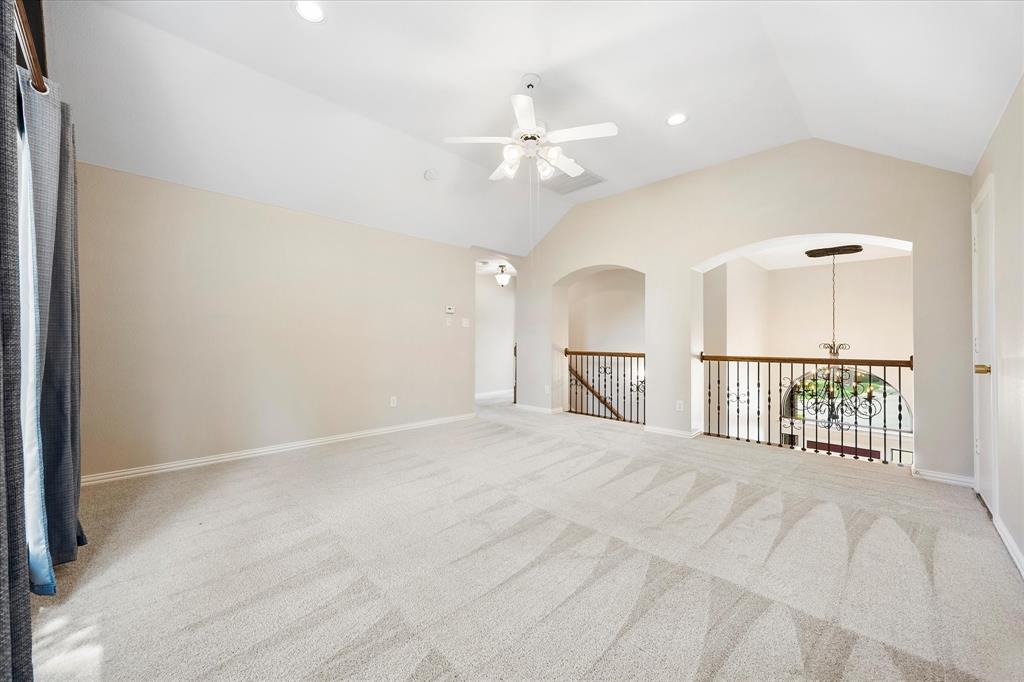 645 Channel Ridge Drive Rockwall, TX 75087 - Photo 23 of 40 The upstairs game room overlooks the foyer.