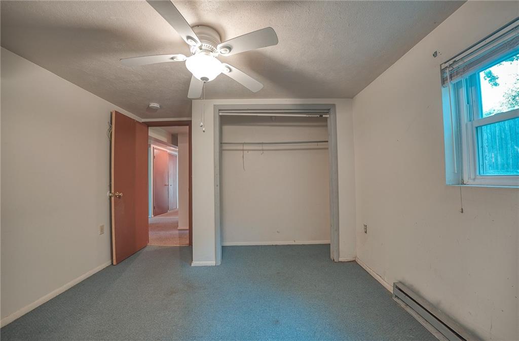 296 East Pike Road Indiana, PA 15701 - Photo 28 of 46 an empty room with windows and chandelier fan