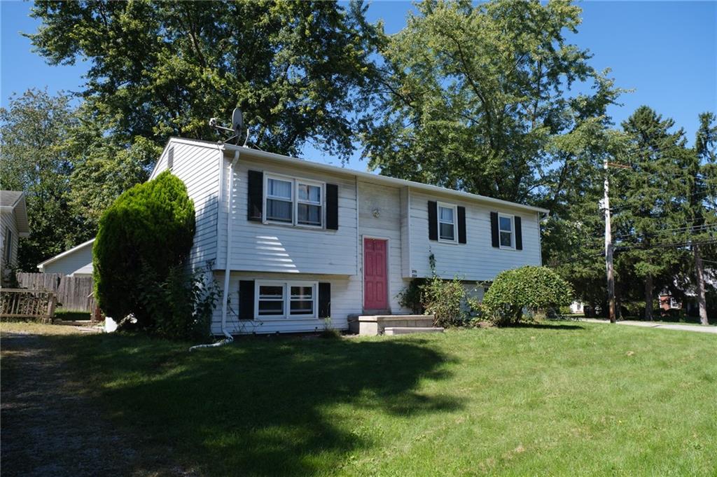 296 East Pike Road Indiana, PA 15701 - Photo 41 of 46 a front view of a house with a yard and garage