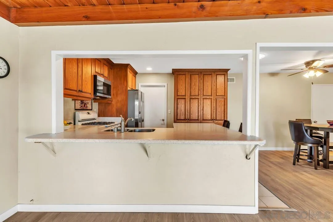 10143 Maple Tree Road Santee, CA 92071 - Photo 11 of 43 a living room with a large window and a table