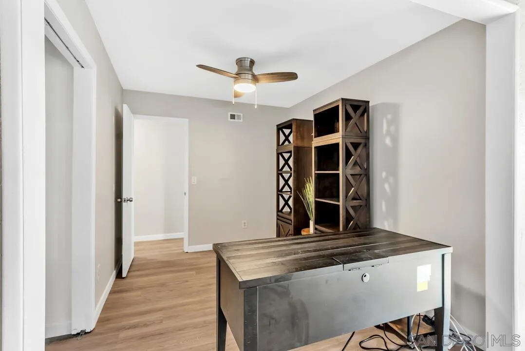 10143 Maple Tree Road Santee, CA 92071 - Photo 17 of 43 a view of kitchen island with wooden floor