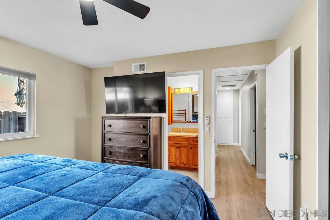 10143 Maple Tree Road Santee, CA 92071 - Photo 20 of 43 a bedroom with a bed and furniture