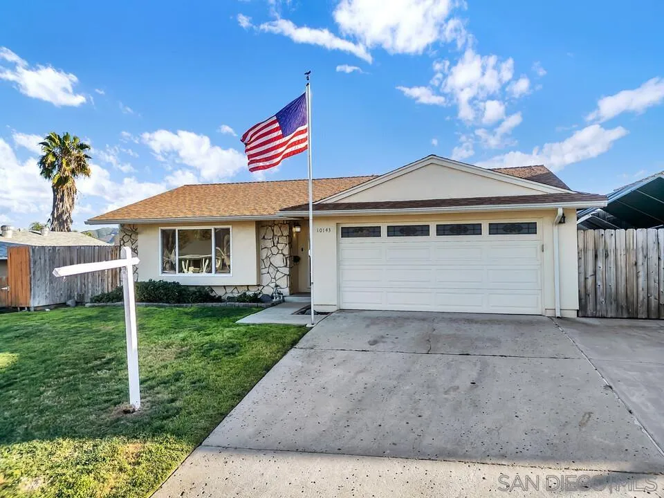10143 Maple Tree Road Santee, CA 92071 - Photo 2 of 43 a front view of a house with garden
