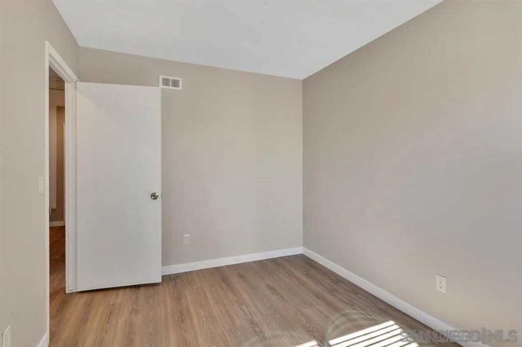 10143 Maple Tree Road Santee, CA 92071 - Photo 24 of 43 a view of an empty room with wooden floor