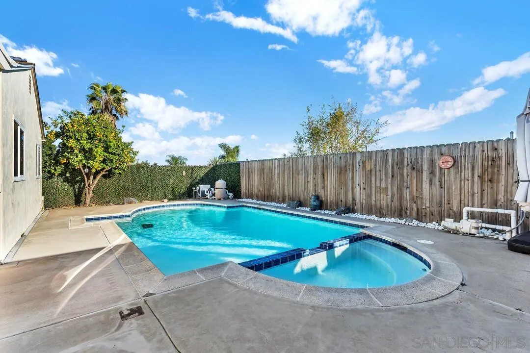 10143 Maple Tree Road Santee, CA 92071 - Photo 26 of 43 a view of a backyard with swimming pool and seating space