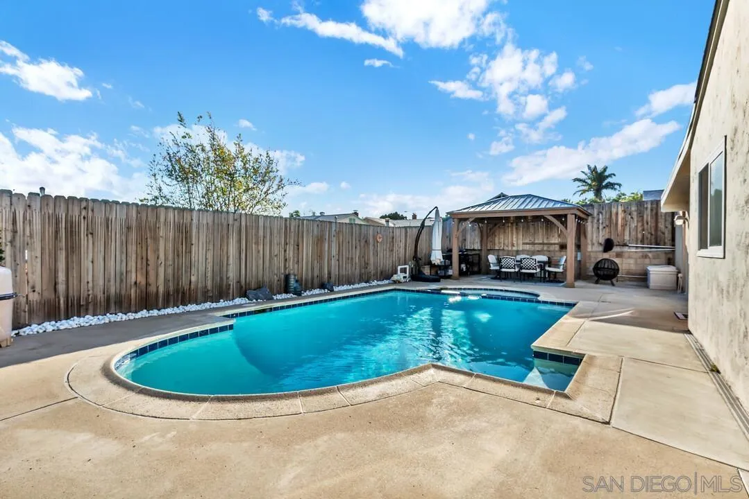 10143 Maple Tree Road Santee, CA 92071 - Photo 29 of 43 a view of a swimming pool with a patio