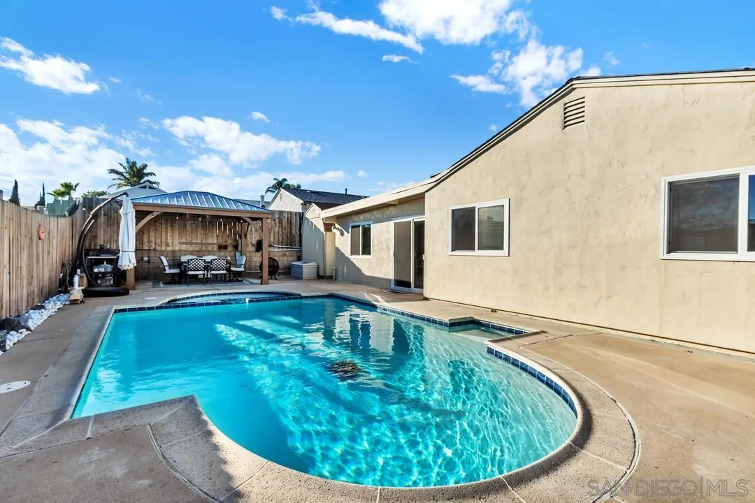 10143 Maple Tree Road Santee, CA 92071 - Photo 30 of 43 a view of a house with swimming pool