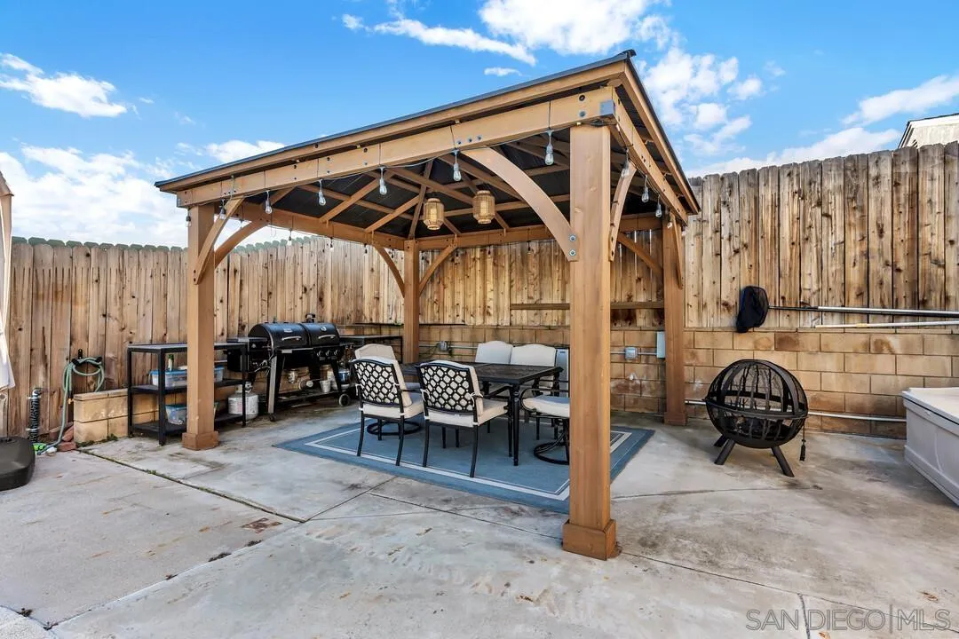 10143 Maple Tree Road Santee, CA 92071 - Photo 31 of 43 a view of backyard with wheel chair and roof