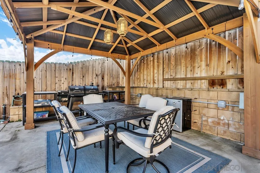 10143 Maple Tree Road Santee, CA 92071 - Photo 32 of 43 a patio with table and chairs