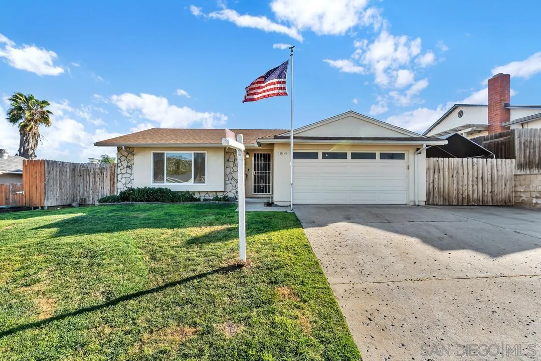 10143 Maple Tree Road Santee, CA 92071 - Photo 4 of 43 a front view of a house with garden