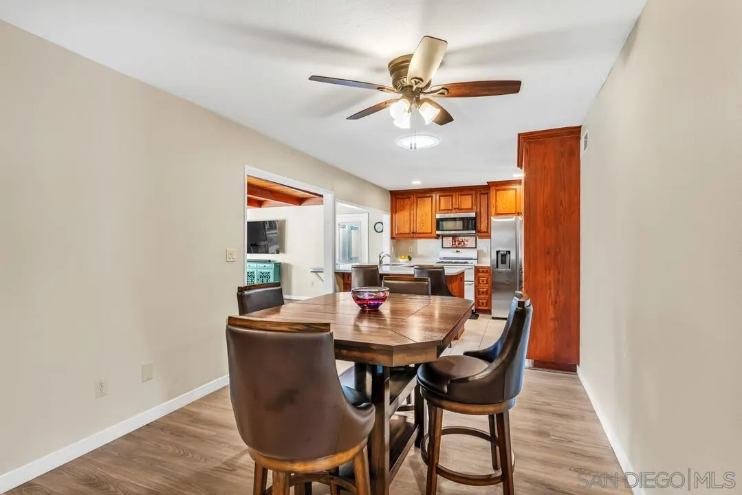 10143 Maple Tree Road Santee, CA 92071 - Photo 7 of 43 a dining room with furniture window and wooden floor