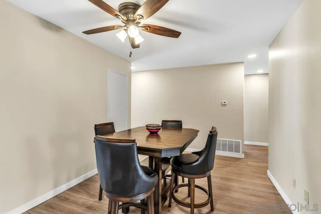 10143 Maple Tree Road Santee, CA 92071 - Photo 8 of 43 a view of a dining room with furniture and wooden floor