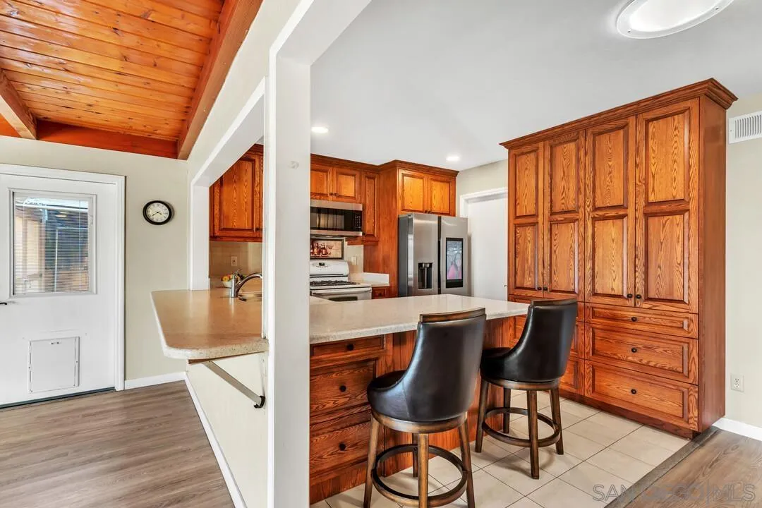 10143 Maple Tree Road Santee, CA 92071 - Photo 10 of 43 a view of a dining room with furniture and window