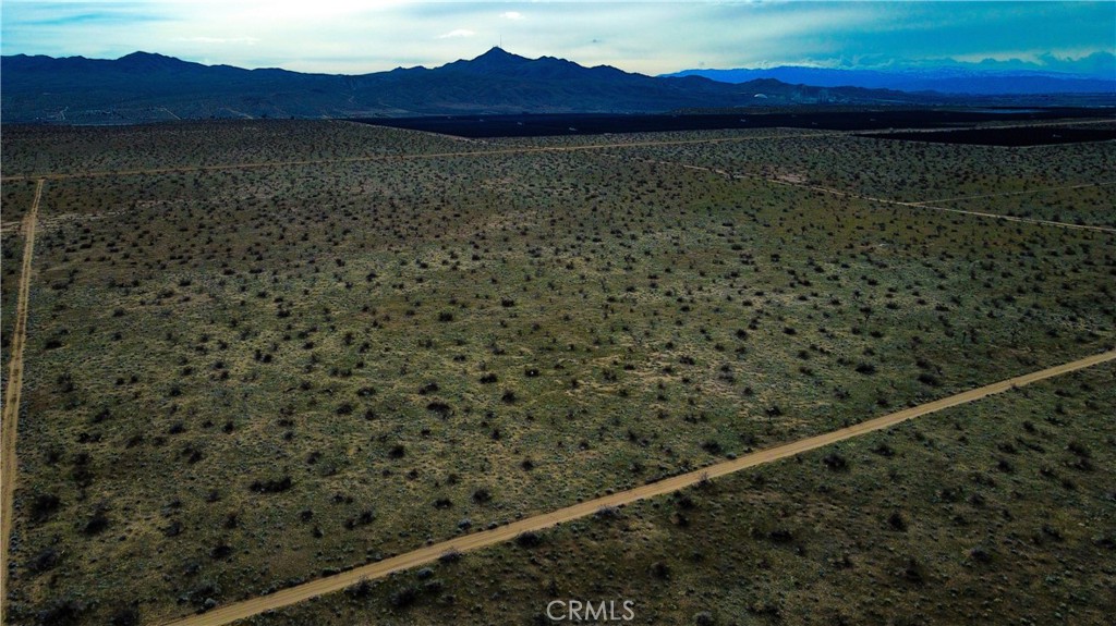749 Torosa/topaz Road Adelanto, CA 92301 - Photo 2 of 7 a view of a room with wooden floor and a city view