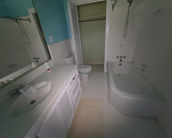 a view of a hallway with windows