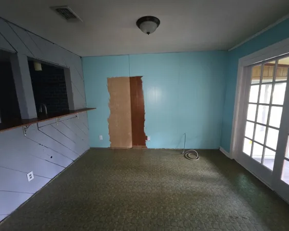 an empty room with windows