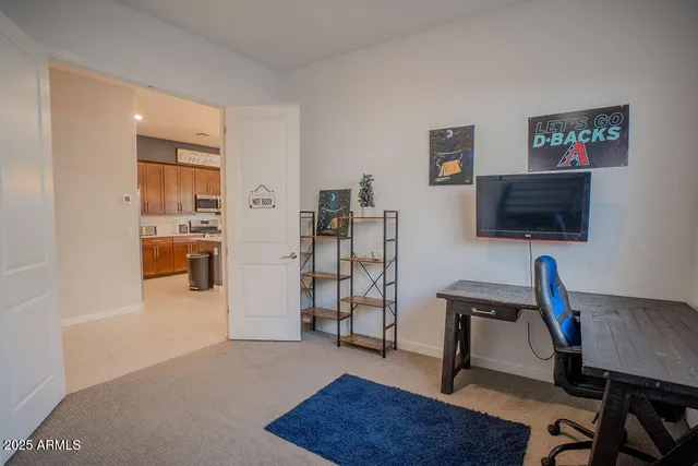 a view of a livingroom with furniture and a flat screen tv