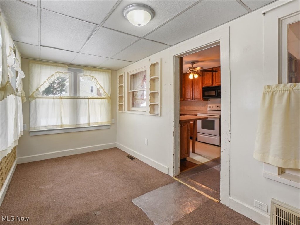 5800 Granger Road Ashtabula, OH 44004 - Photo 16 of 32 Carpeted spare room featuring a drop ceiling