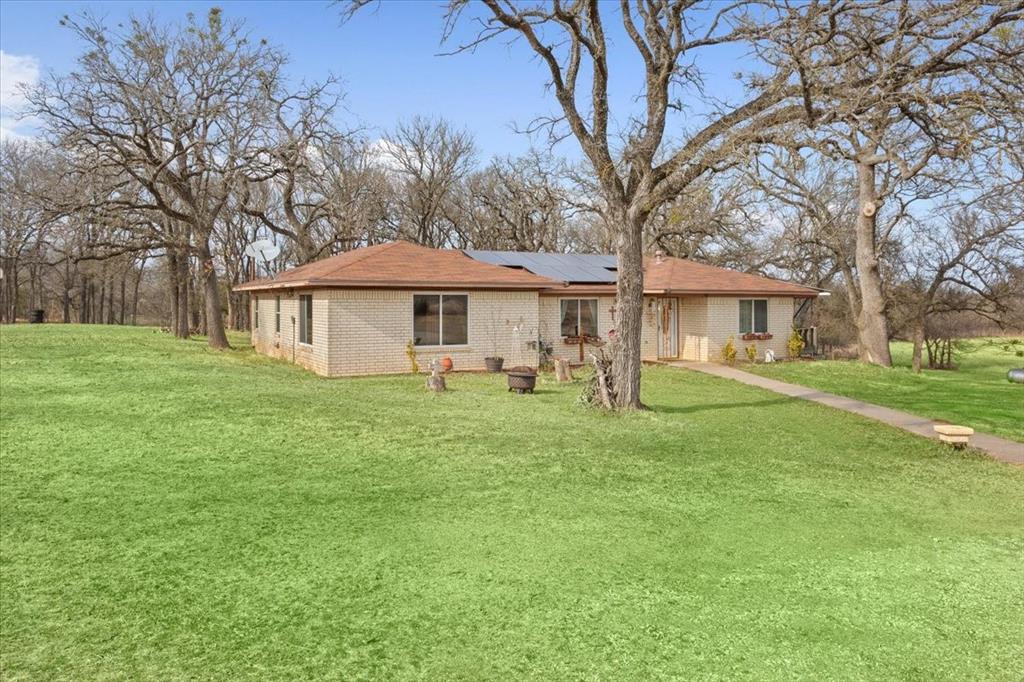 1832 West White Oak Road West, TX 76691 - Photo 5 of 30 a front view of a house with a yard