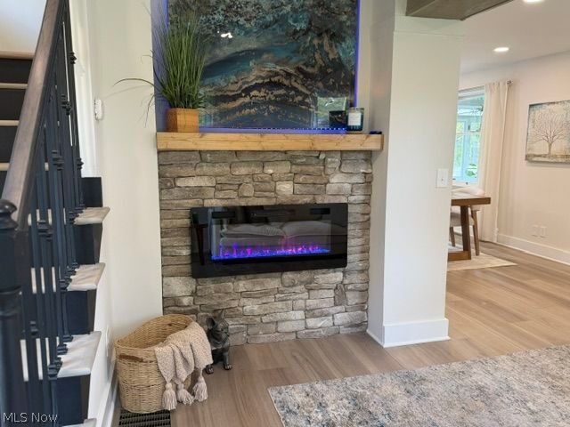 5366 Barton Road North Ridgeville, OH 44039 - Photo 14 of 49 Living Room with electric fireplace, stone mantel, and recessed lighting.