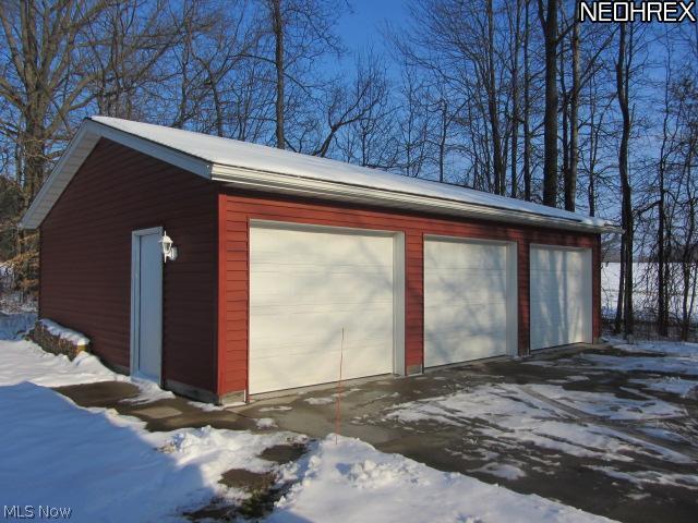 5204 Rootstown Road Ravenna, OH 44266 - Photo 2 of 20 The 3-car detached garage has concrete floor, drain, electric, and loads of extra parking. Very nicely done.