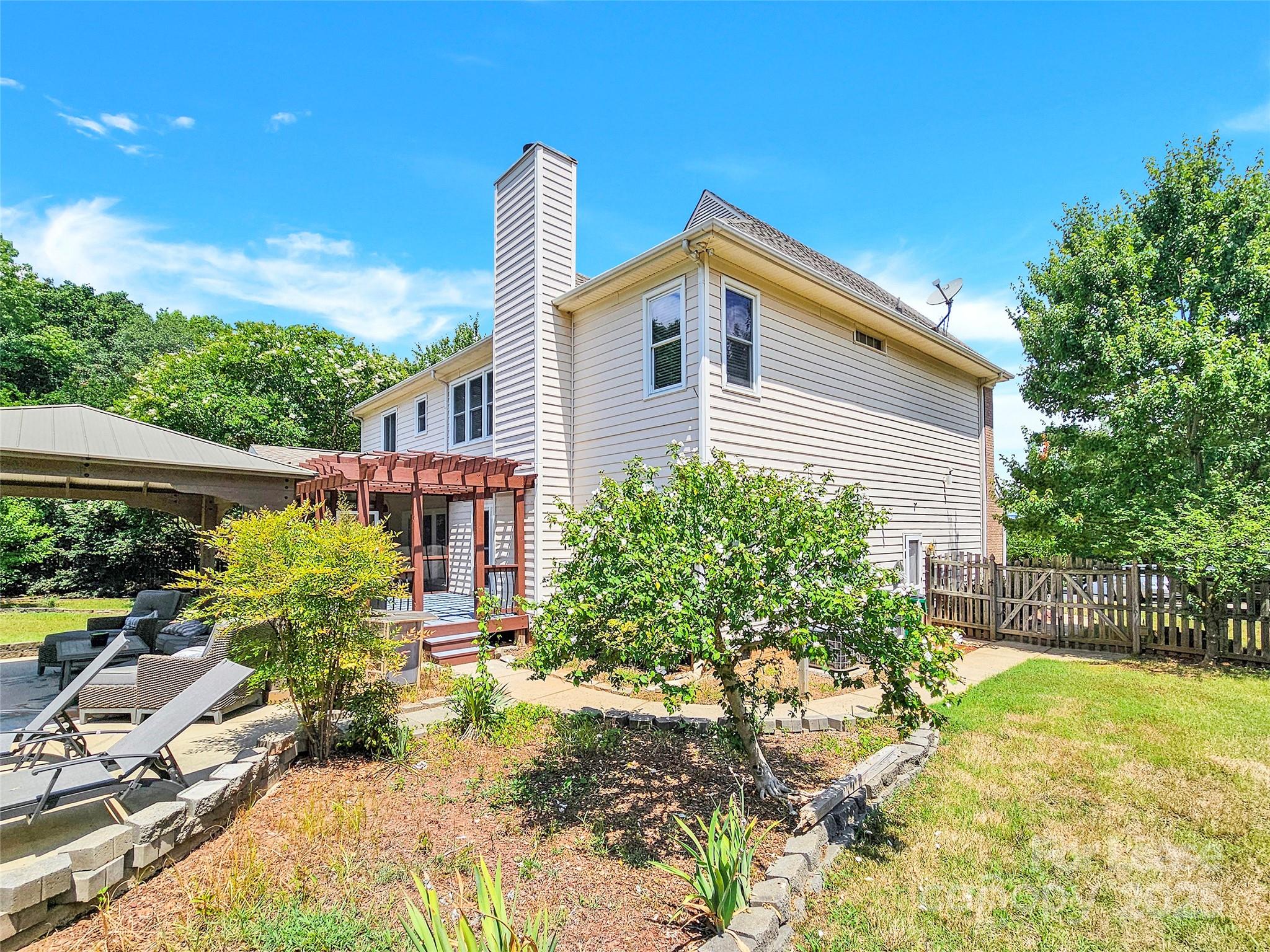8534 Headford Road Charlotte, NC 28277 - Photo 2 of 48 a house view with a garden space