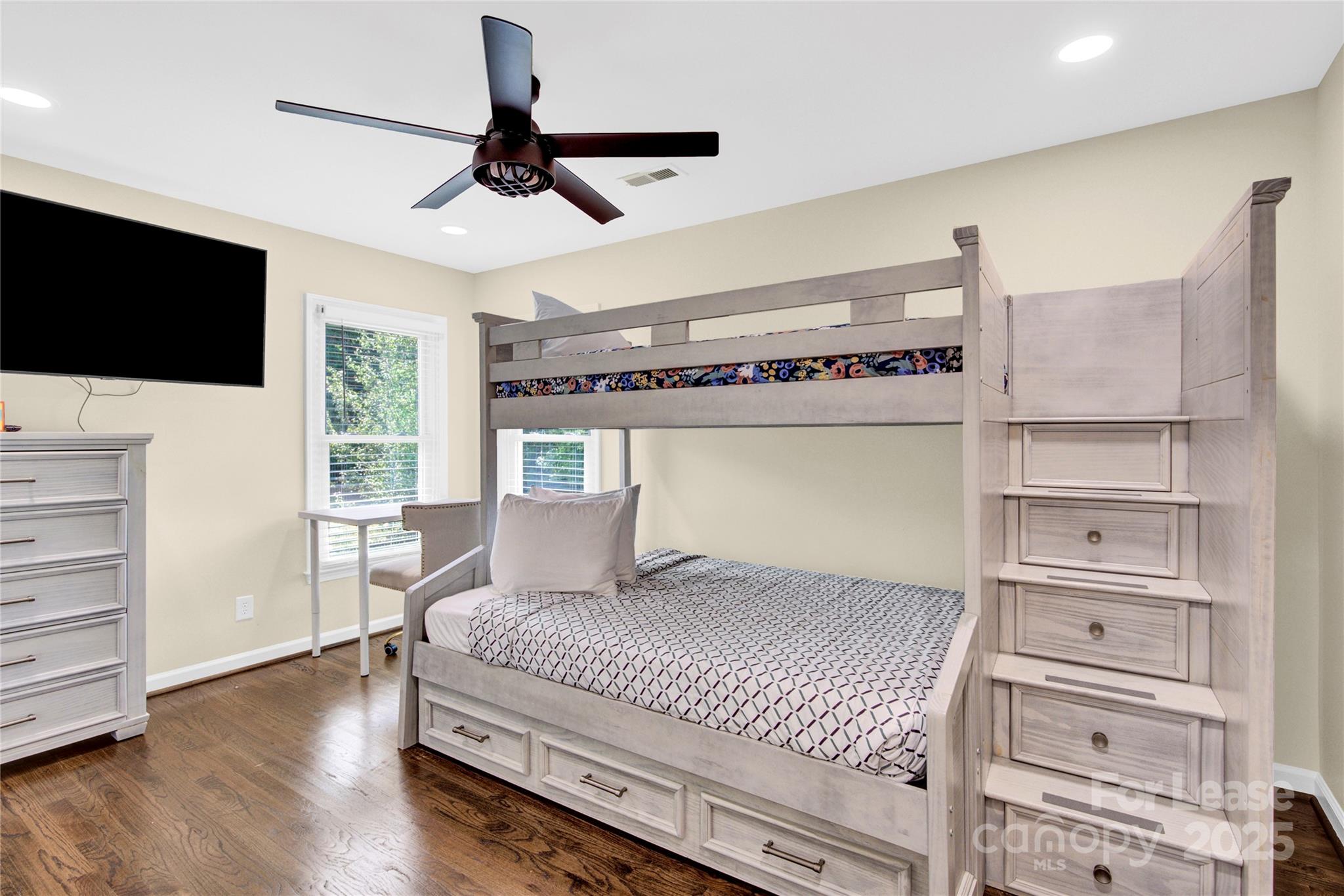 8534 Headford Road Charlotte, NC 28277 - Photo 28 of 48 a bedroom with a bed and flat screen tv