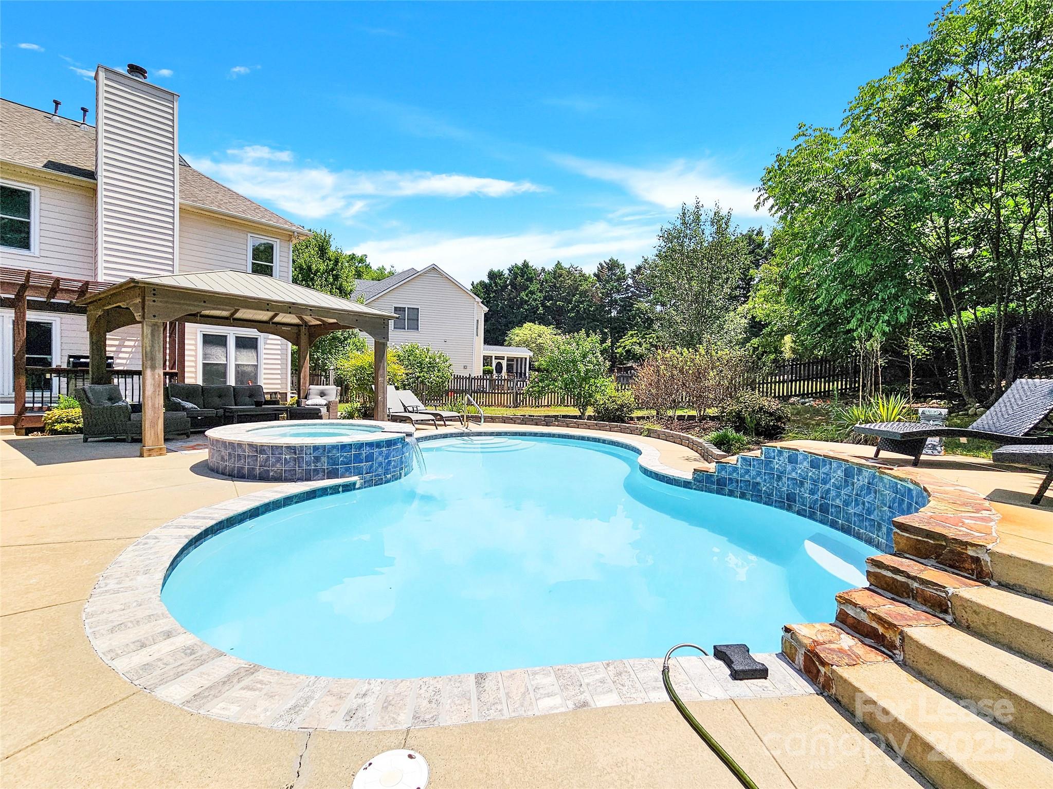 8534 Headford Road Charlotte, NC 28277 - Photo 6 of 48 a view of a swimming pool with a patio