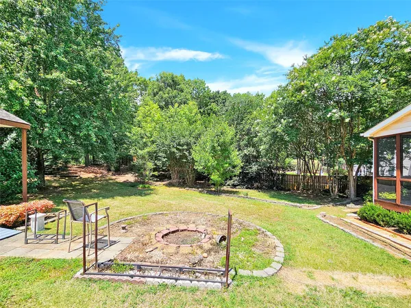 a view of a swimming pool with an outdoor space and seating area